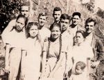 The Alcantara family posing with five American GIs